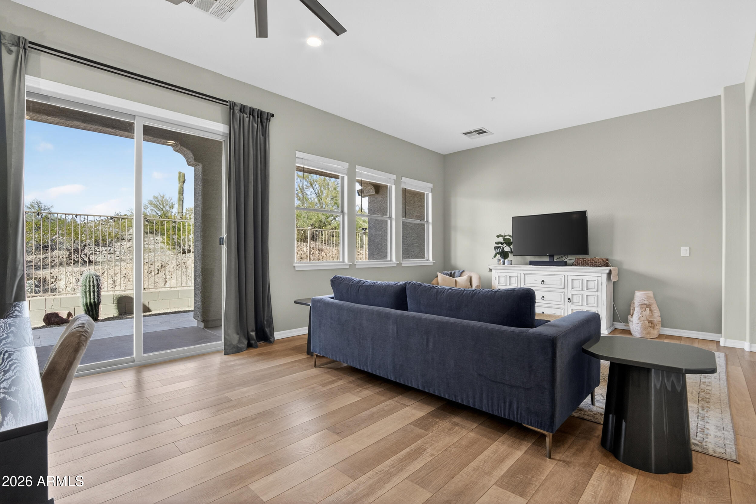 18377 Verdin Road Goodyear, AZ 85338 - Photo 17 of 55 a living room with furniture and a flat screen tv
