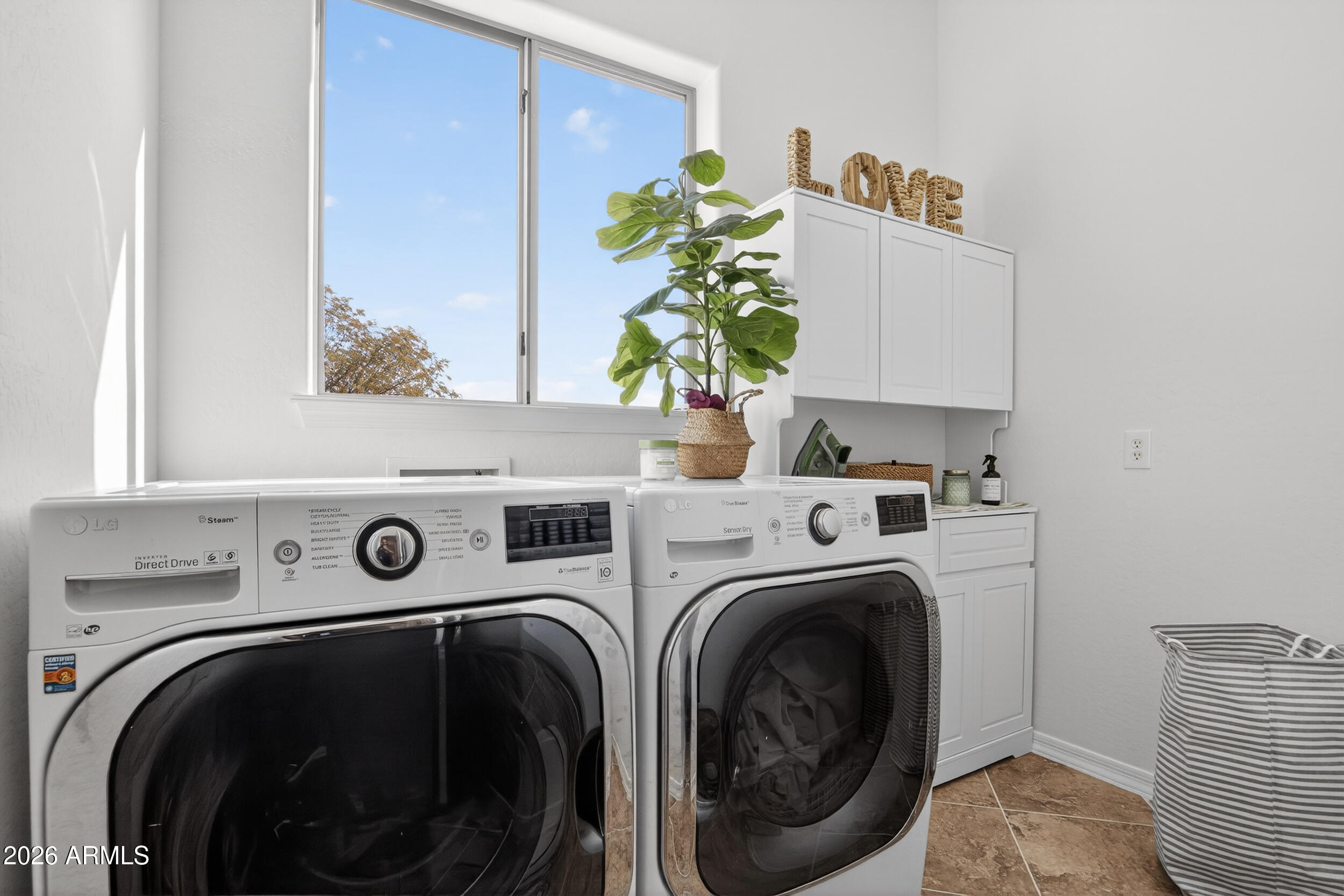 18377 Verdin Road Goodyear, AZ 85338 - Photo 18 of 55 a utility room with dryer and washer