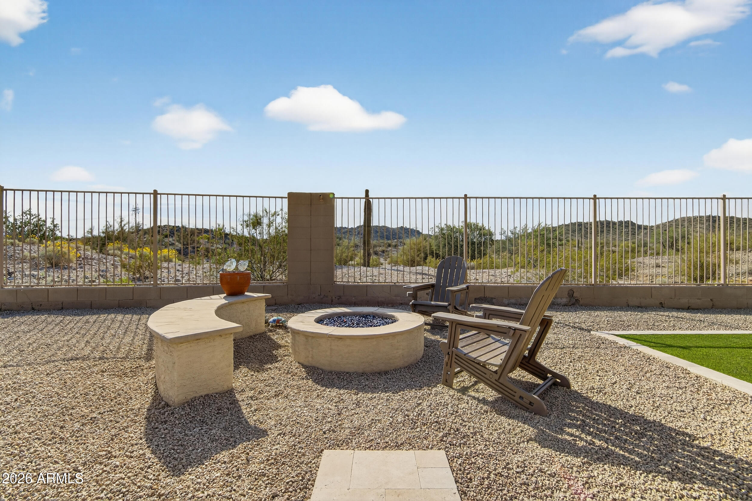 18377 Verdin Road Goodyear, AZ 85338 - Photo 19 of 55 a living room with a couch and a floor to ceiling window