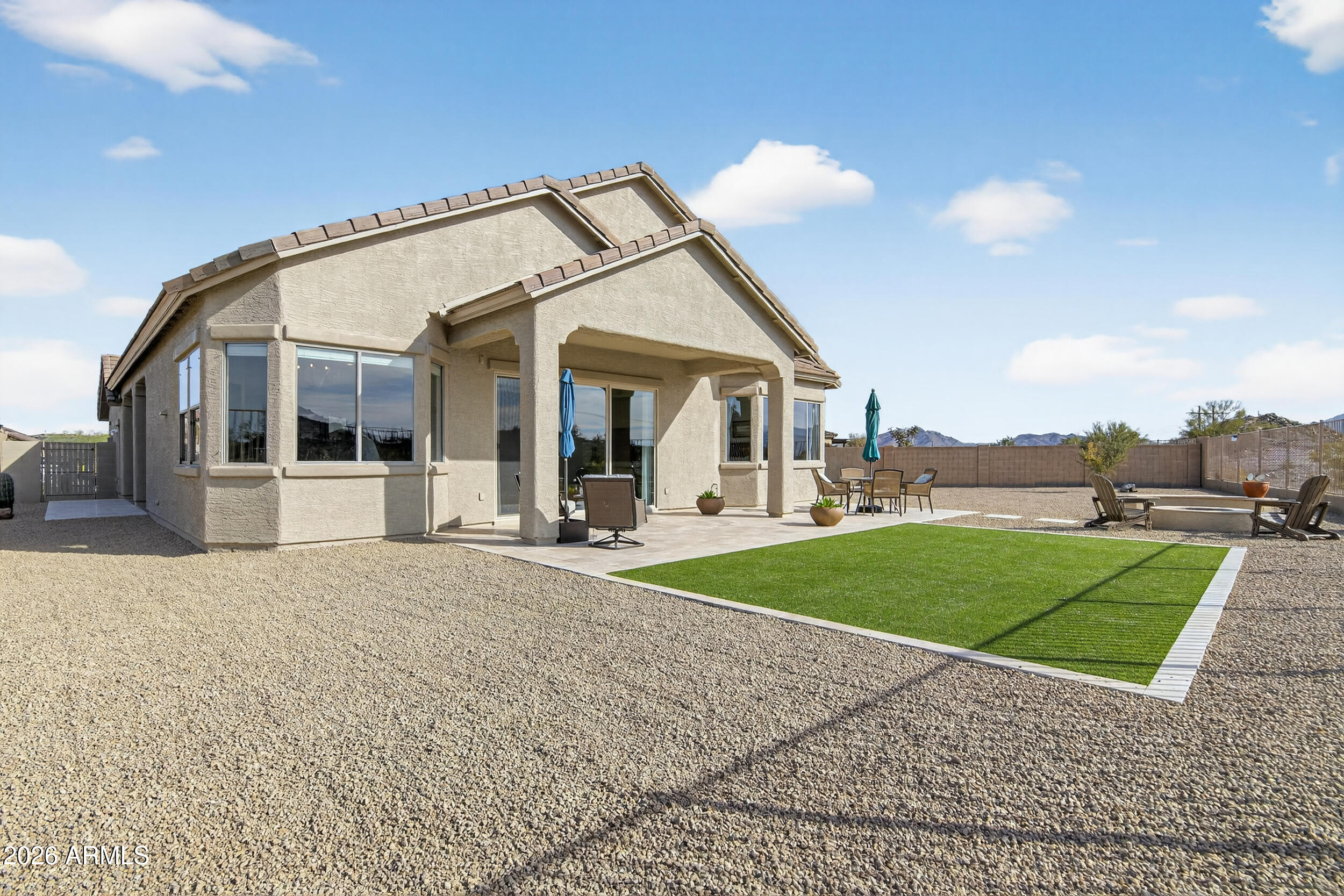 18377 Verdin Road Goodyear, AZ 85338 - Photo 20 of 55 a view of a house with a patio