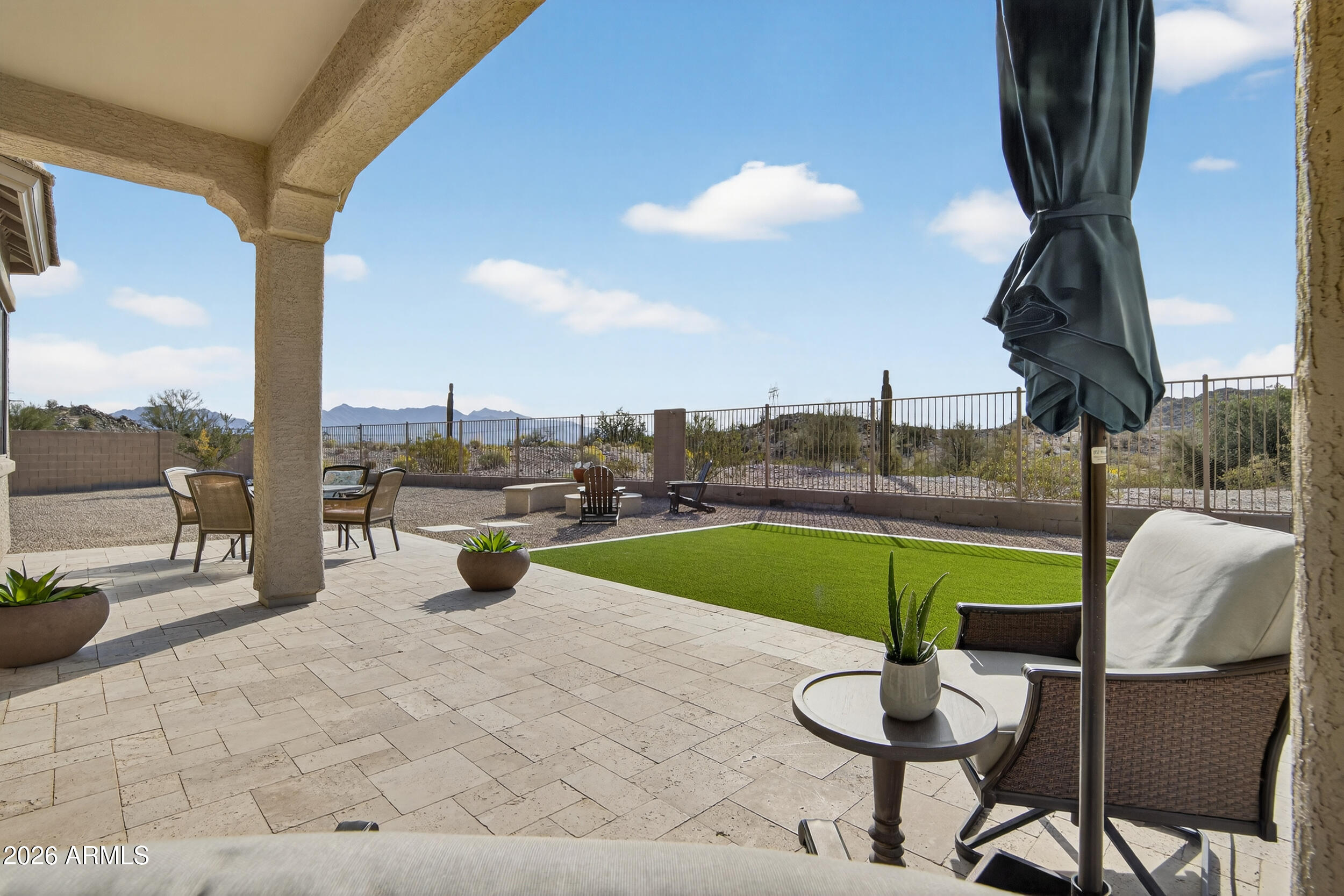 18377 Verdin Road Goodyear, AZ 85338 - Photo 21 of 55 a view of a swimming pool with a lounge chairs