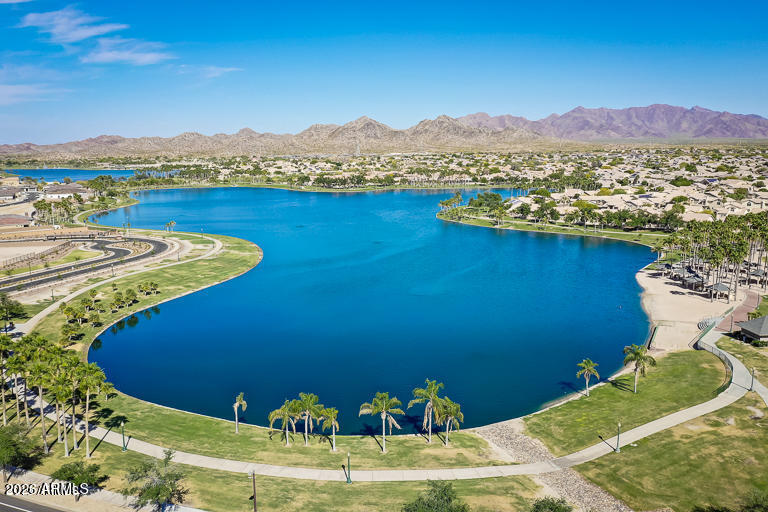 18377 Verdin Road Goodyear, AZ 85338 - Photo 35 of 55 a view of a lake with a mountain