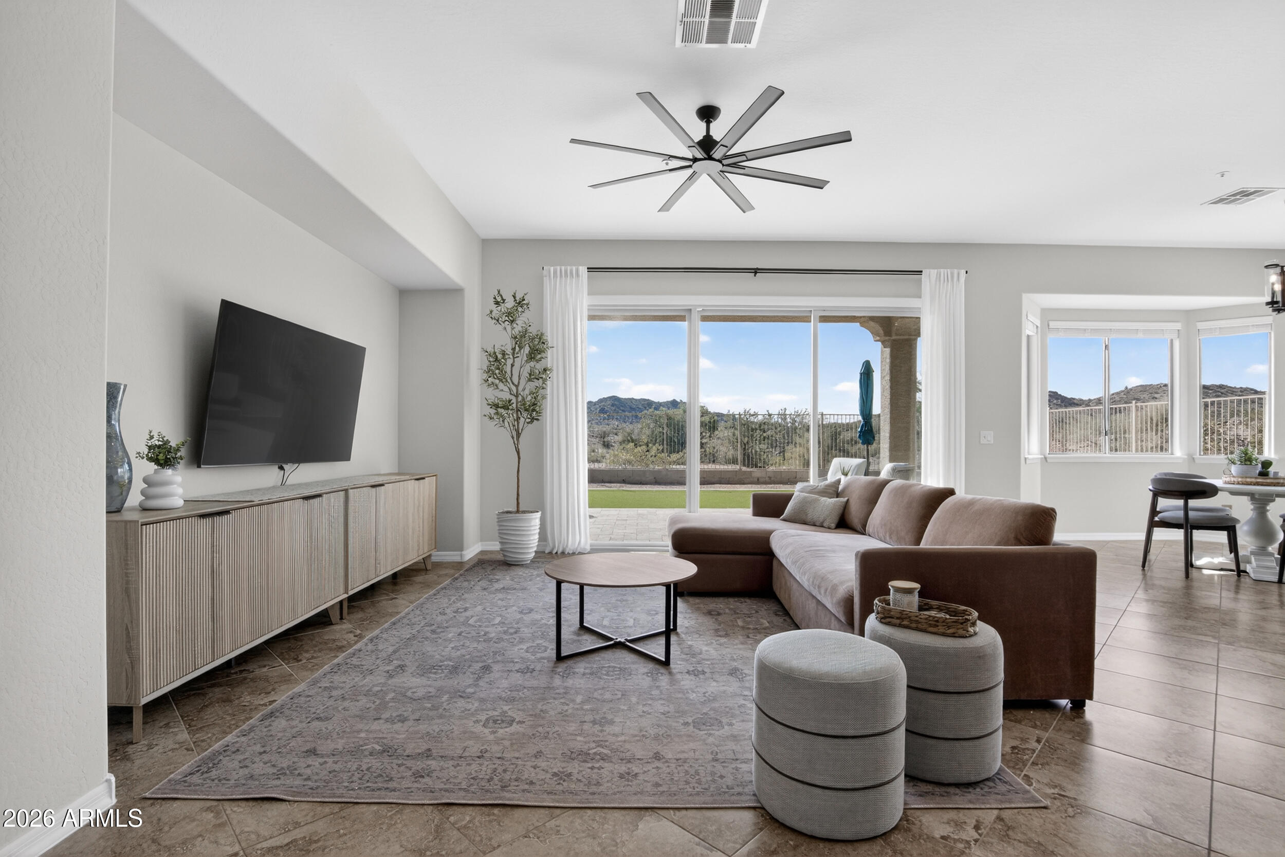 18377 Verdin Road Goodyear, AZ 85338 - Photo 5 of 55 a living room with furniture and a flat screen tv