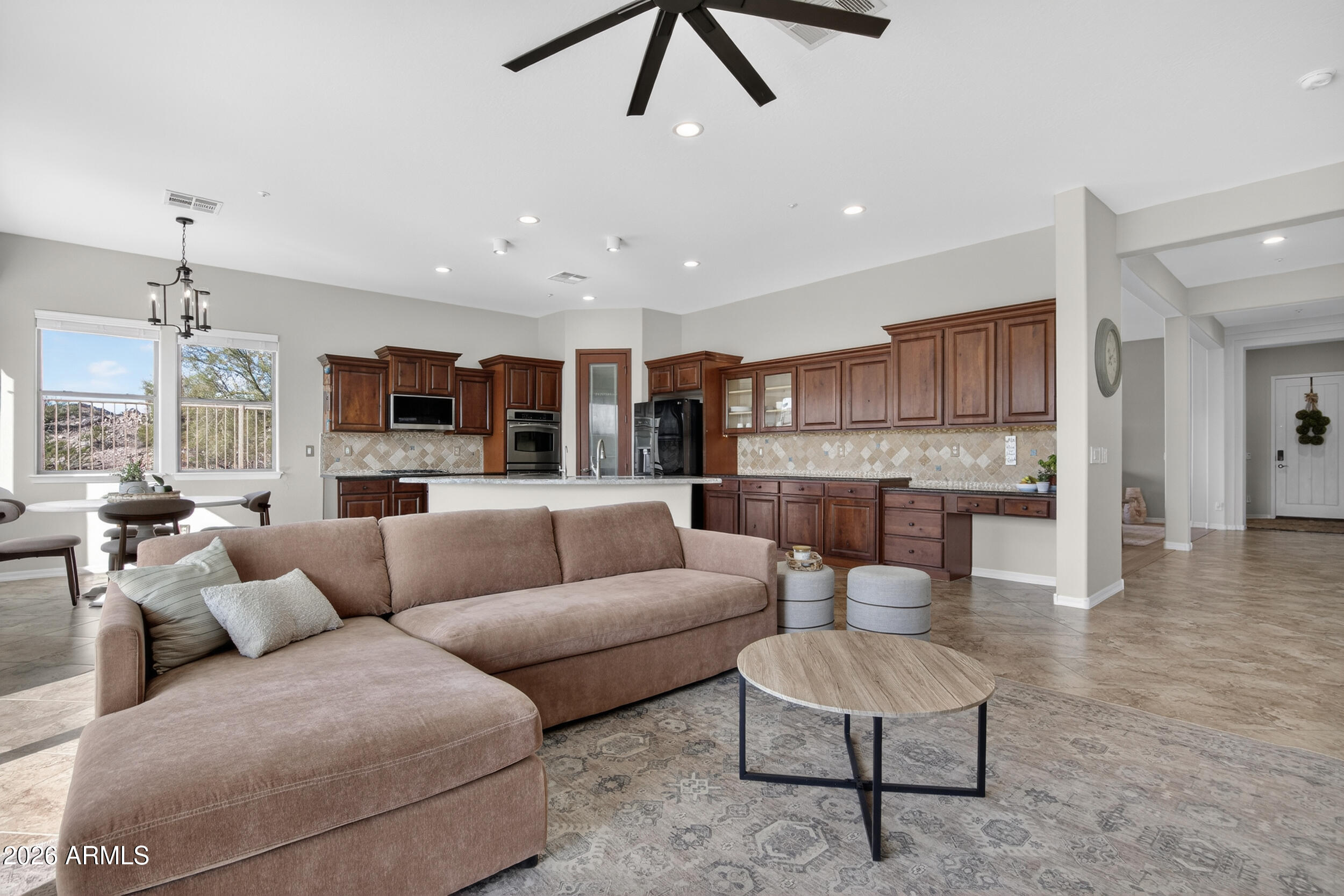 18377 Verdin Road Goodyear, AZ 85338 - Photo 8 of 55 a living room with furniture and kitchen view