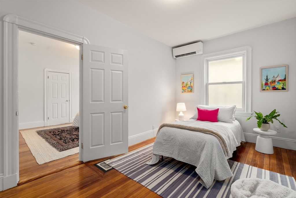 206 Pearl Street, Unit 3 Somerville, MA 02145 - Photo 14 of 18 a bedroom with a bed and a window