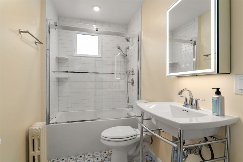 206 Pearl Street, Unit 3 Somerville, MA 02145 - Photo 16 of 18 a bathroom with a sink toilet and shower