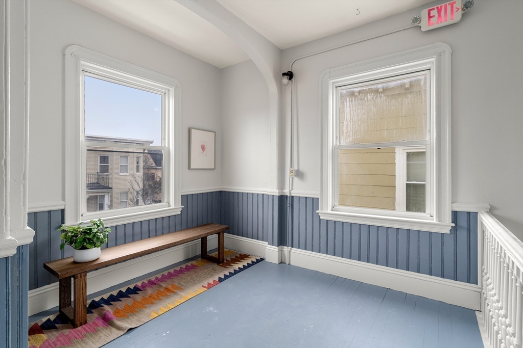 206 Pearl Street, Unit 3 Somerville, MA 02145 - Photo 18 of 18 a living room with furniture and a window