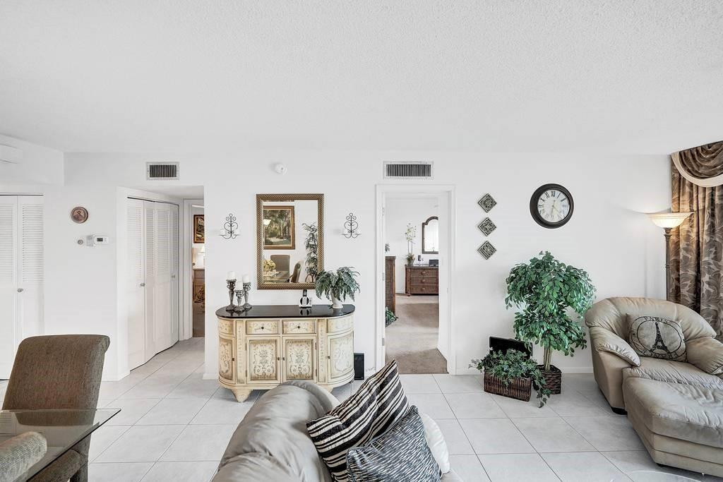 303 North Riverside Drive, Unit 503 Pompano Beach, FL 33062 - Photo 15 of 29 a living room with furniture and wooden floor