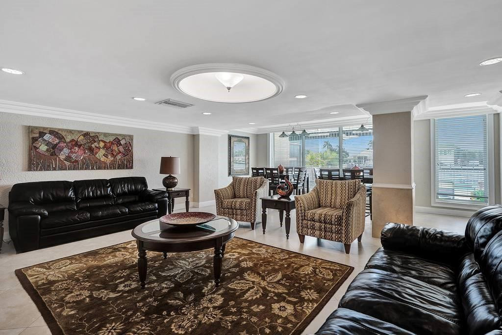 303 North Riverside Drive, Unit 503 Pompano Beach, FL 33062 - Photo 20 of 29 a living room with furniture and a rug