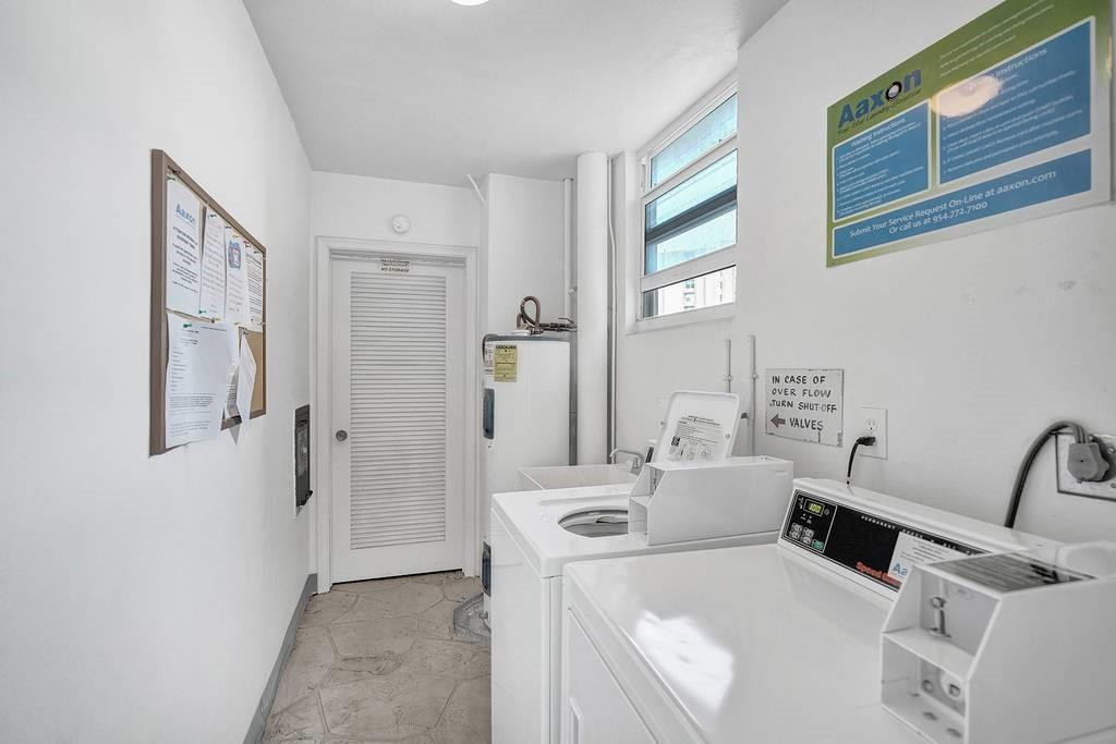 303 North Riverside Drive, Unit 503 Pompano Beach, FL 33062 - Photo 24 of 29 a room with a washer and dryer