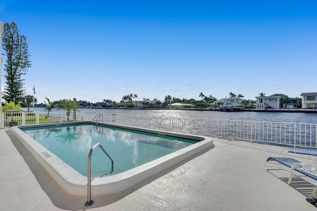 303 North Riverside Drive, Unit 503 Pompano Beach, FL 33062 - Photo 4 of 29 a view of a swimming pool with a terrace
