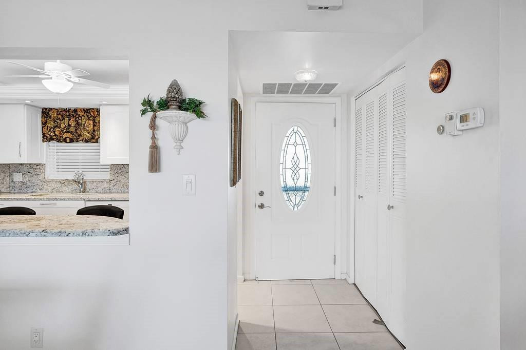 303 North Riverside Drive, Unit 503 Pompano Beach, FL 33062 - Photo 7 of 29 a bathroom with a sink and a mirror