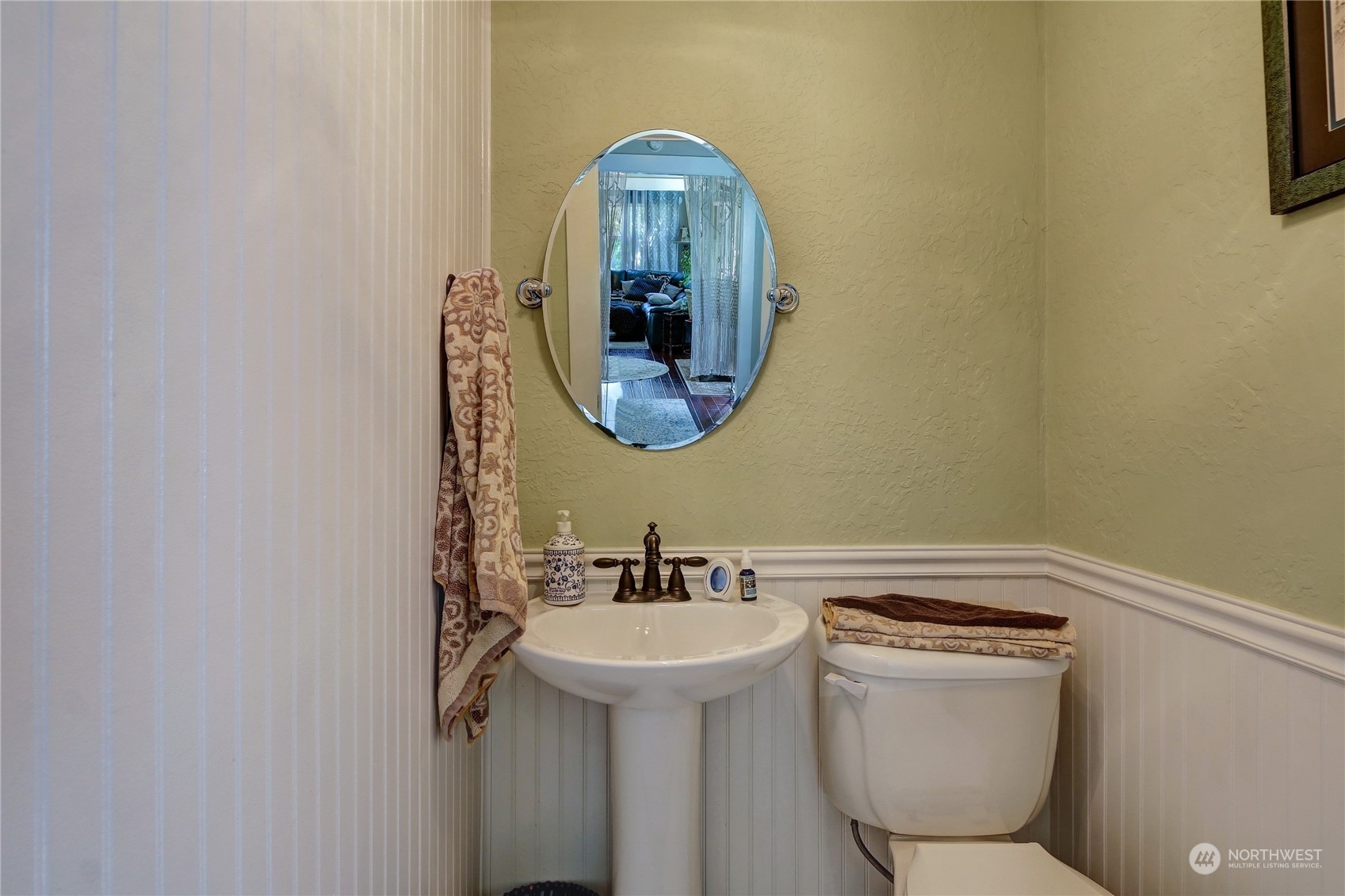 2203 Rockefeller Avenue Everett, WA 98201 - Photo 12 of 31 a bathroom with a toilet sink and mirror