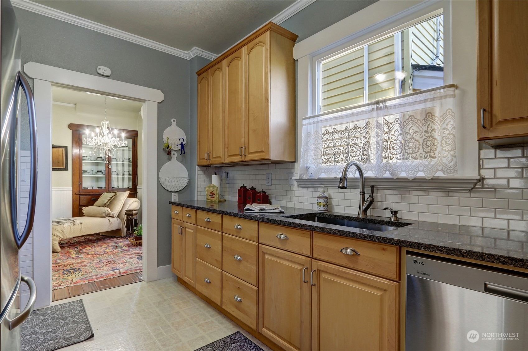 2203 Rockefeller Avenue Everett, WA 98201 - Photo 15 of 31 a kitchen with a sink and cabinets