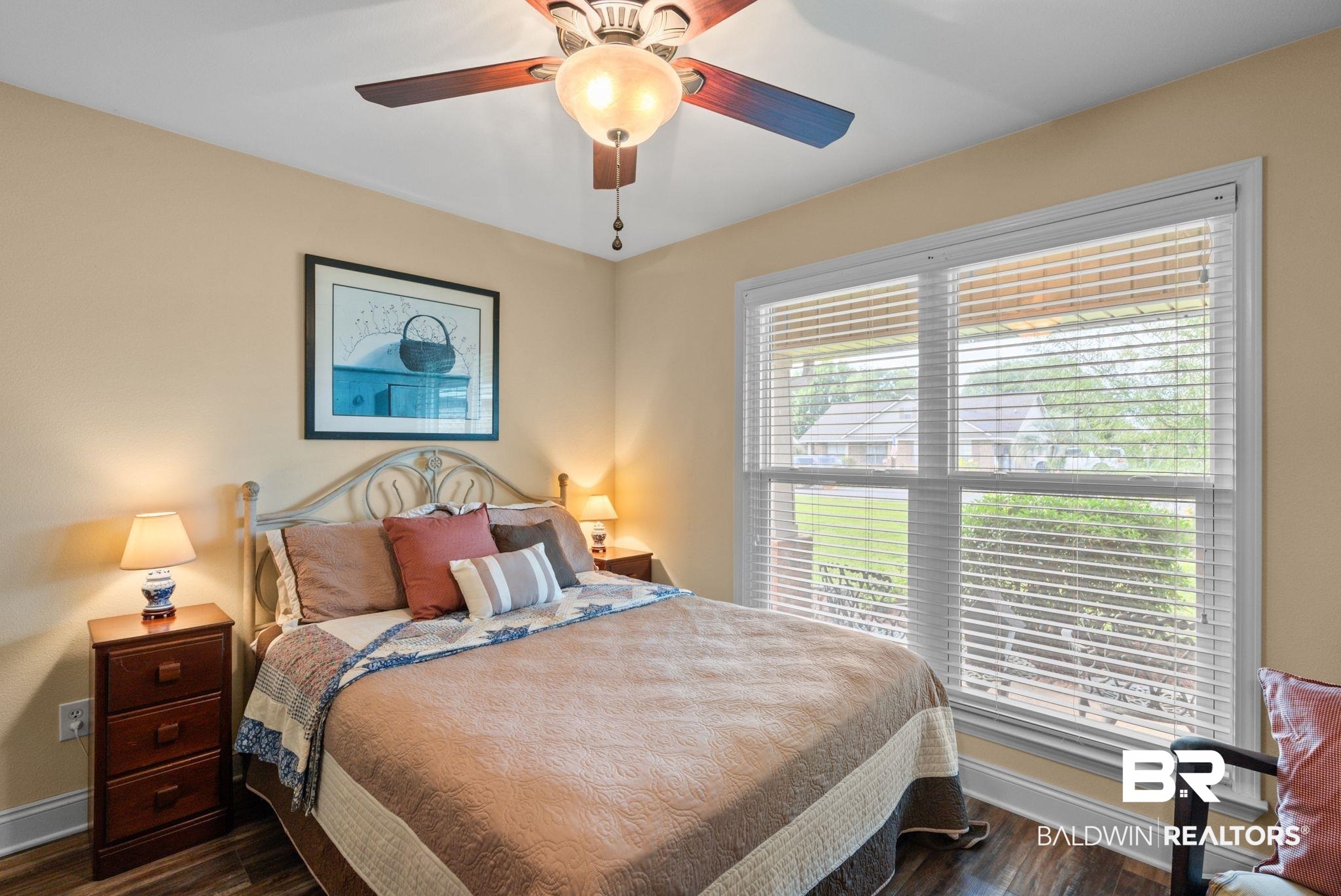 562 Vestige Mews Foley, AL 36535 - Photo 31 of 54 Spacious room featuring wood-finish flooring, a ceiling fan with integrated lighting, and a large window with blinds