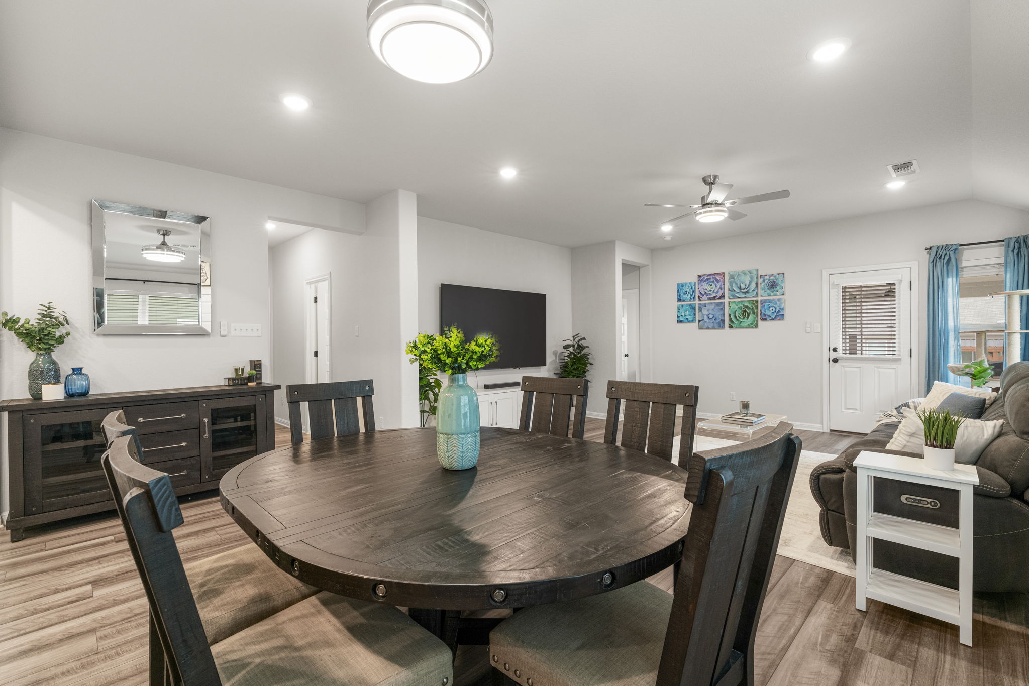 19412 Forman Drive Pflugerville, TX 78660 - Photo 14 of 34 Neutral finishes and modern lighting allow the space to easily complement a variety of interior styles.