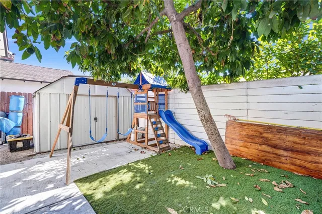 a view of a backyard with a slide