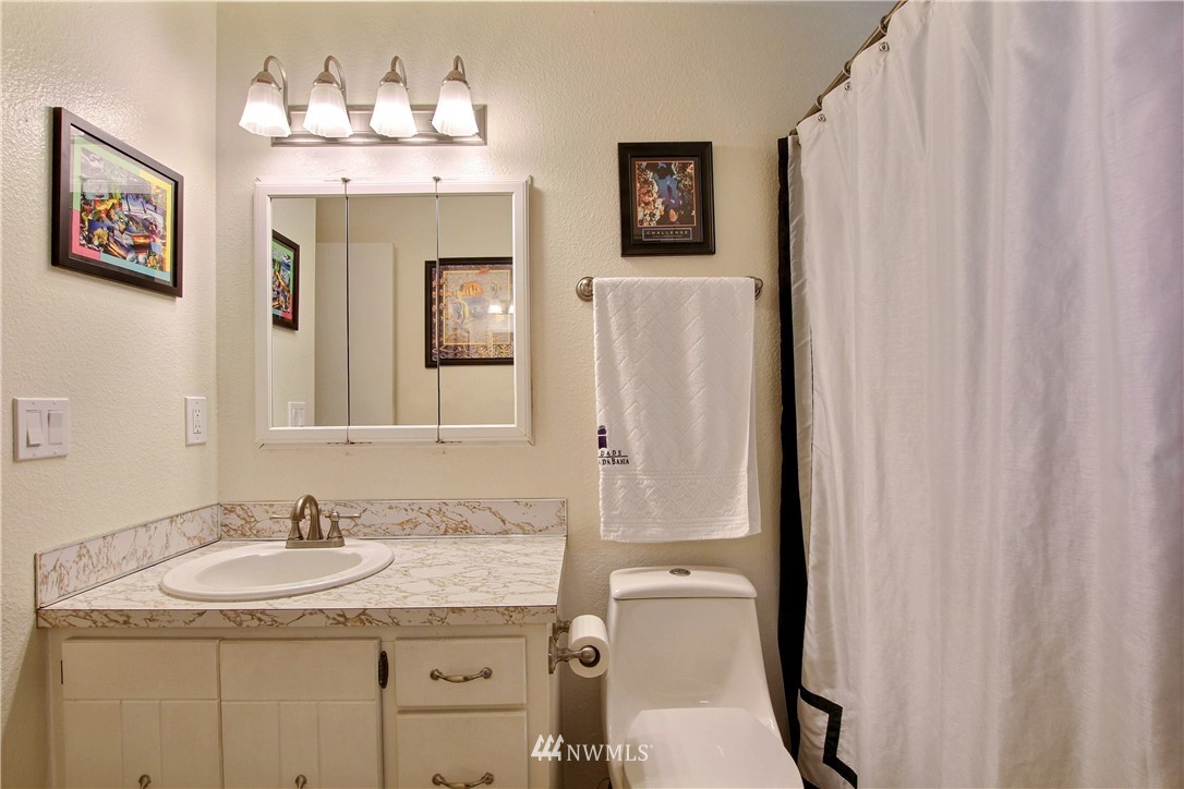 509 223rd Street Southwest Bothell, WA 98021 - Photo 18 of 39 a bathroom with a granite countertop sink and a mirror