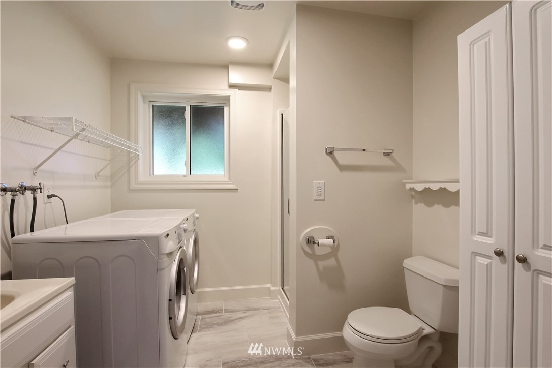 509 223rd Street Southwest Bothell, WA 98021 - Photo 26 of 39 a bathroom with a sink a toilet and shower