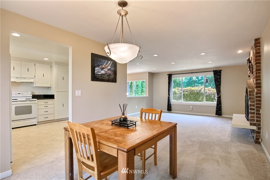 509 223rd Street Southwest Bothell, WA 98021 - Photo 4 of 39 a view of a kitchen with a table and chairs