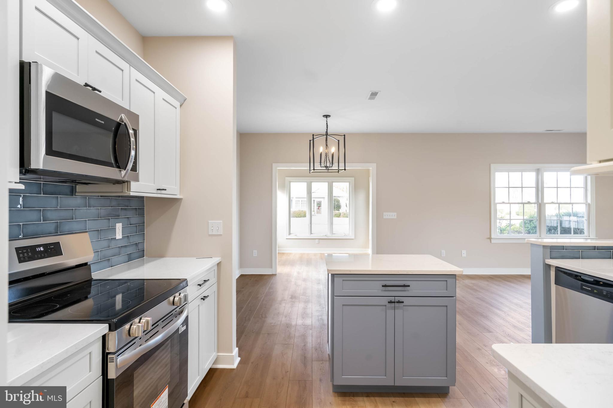 14 Mulberry Street Georgetown, DE 19947 - Photo 5 of 24 Blue tile backsplash & new appliances