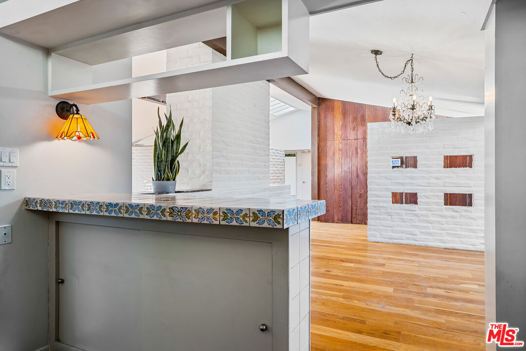 2255 Stradella Road Los Angeles, CA 90077 - Photo 13 of 33 a bathroom with a sink and a mirror