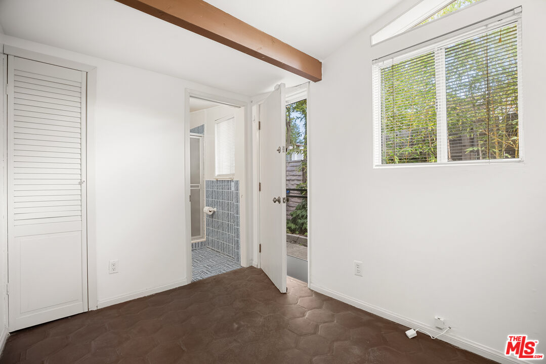 2255 Stradella Road Los Angeles, CA 90077 - Photo 26 of 33 an empty room with windows