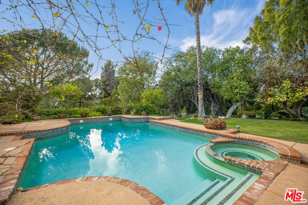 2255 Stradella Road Los Angeles, CA 90077 - Photo 30 of 33 a view of a swimming pool with a yard