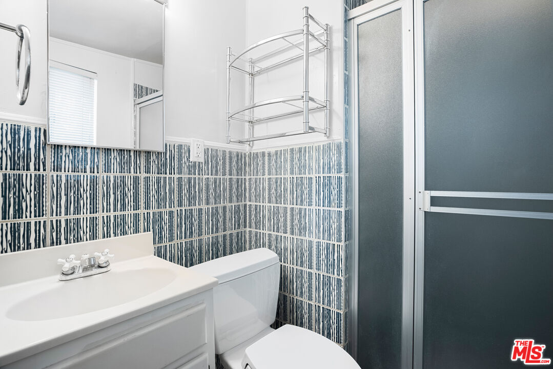 2255 Stradella Road Los Angeles, CA 90077 - Photo 33 of 33 a bathroom with a sink a toilet and shower