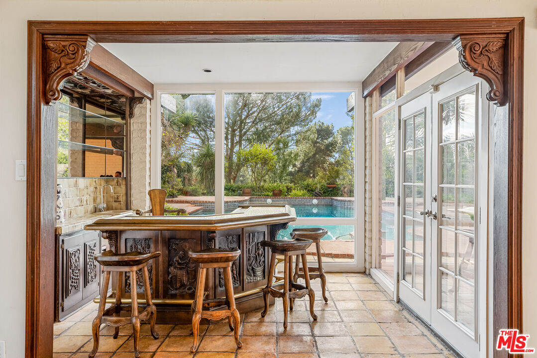 2255 Stradella Road Los Angeles, CA 90077 - Photo 9 of 33 a view of a dining room with furniture window and outside view