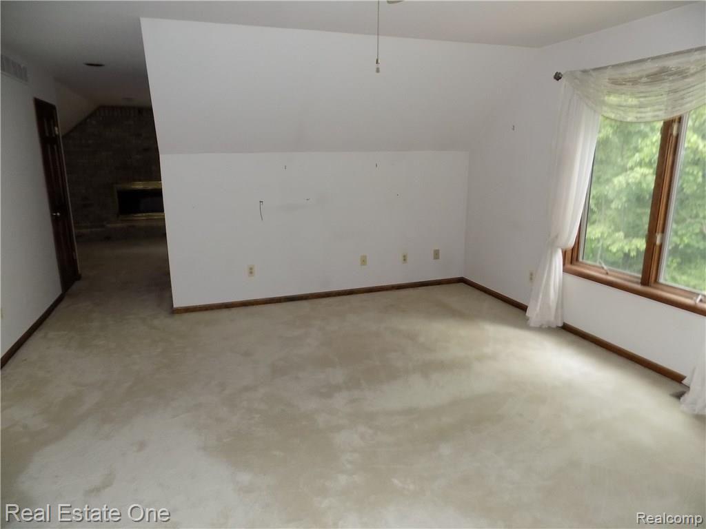 4650 Clyde Road Holly, MI 48442 - Photo 44 of 68 Master suite looking across bedroom towards the sitting room