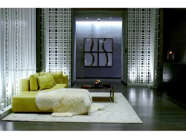 a living room with a rug