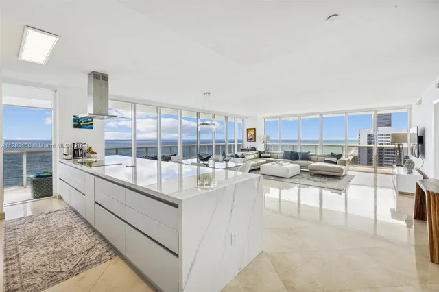 a large white kitchen with lots of counter top space