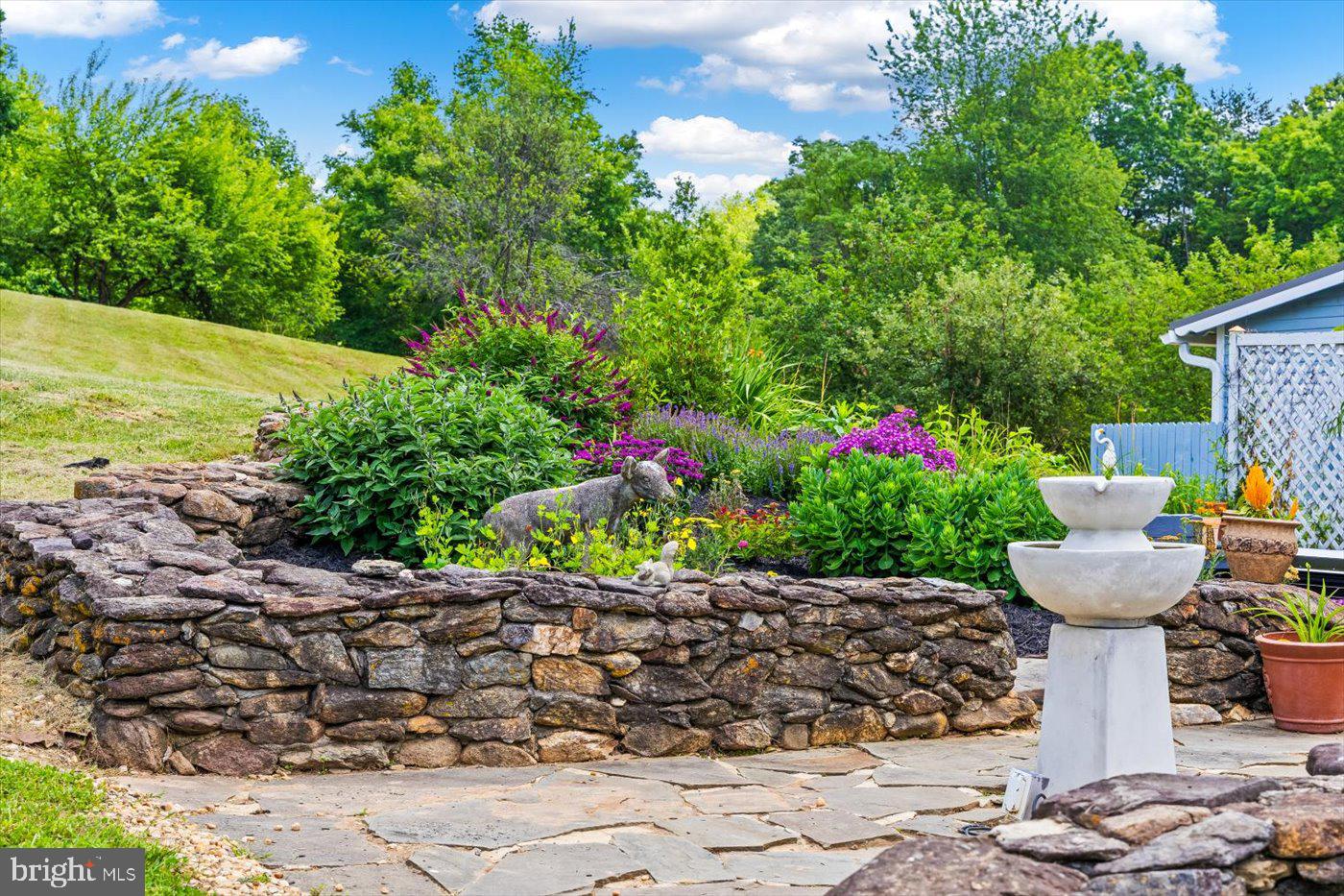 823 Scrabble Road Castleton, VA 22716 - Photo 54 of 94 Gorgeous Stone Gardens Wrap around the Farm
