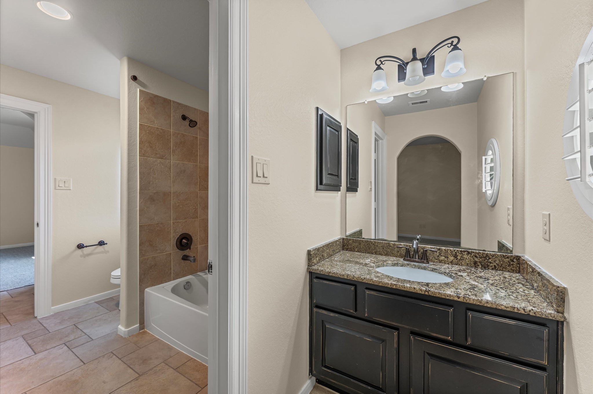 7 North Beech Springs Circle Spring, TX 77389 - Photo 38 of 50 a bathroom with a granite countertop sink mirror and bathtub