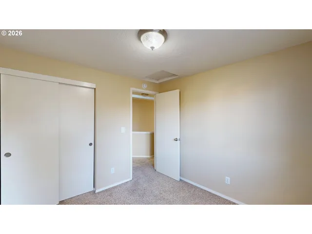 a open living room with a bathroom and a sink