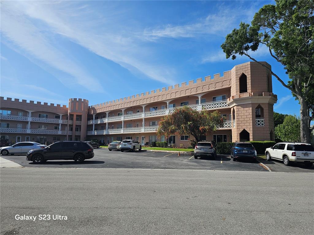 2457 Ecuadorian Way, Unit 75 Clearwater, FL 33763 - Photo 1 of 62 a car parked in front of a building