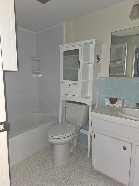 2457 Ecuadorian Way, Unit 75 Clearwater, FL 33763 - Photo 13 of 62 a bathroom with a sink toilet and shower