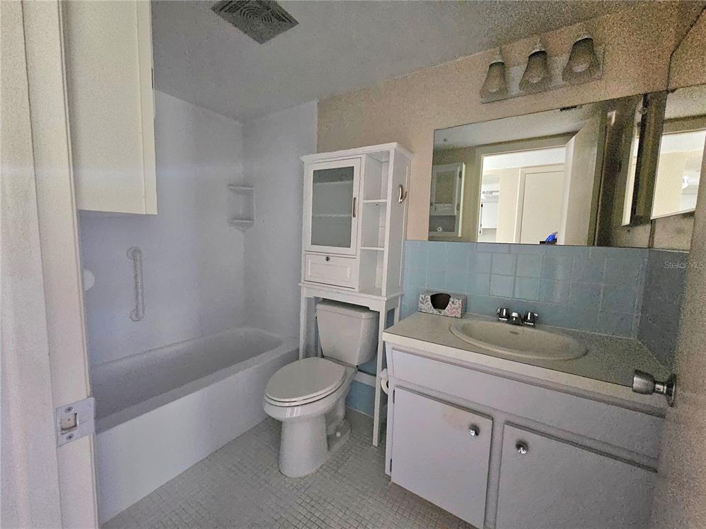 2457 Ecuadorian Way, Unit 75 Clearwater, FL 33763 - Photo 15 of 62 a bathroom with a sink a toilet and shower
