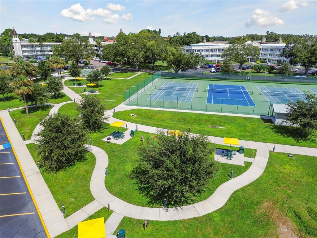 2457 Ecuadorian Way, Unit 75 Clearwater, FL 33763 - Photo 23 of 62 a view of a swimming pool with a garden