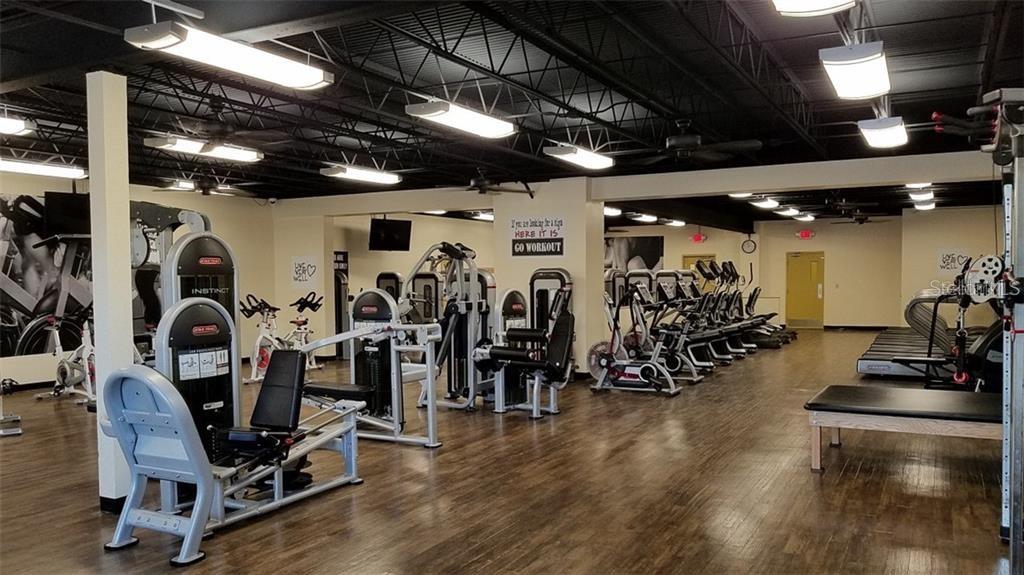 2457 Ecuadorian Way, Unit 75 Clearwater, FL 33763 - Photo 37 of 62 a view of a room with gym equipment