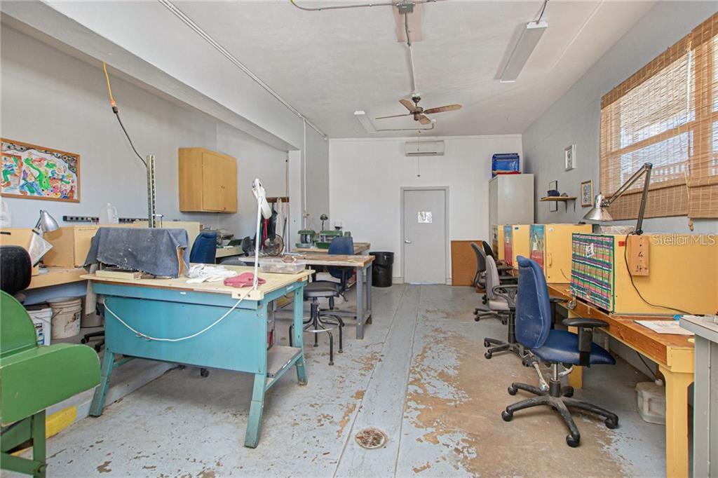 2457 Ecuadorian Way, Unit 75 Clearwater, FL 33763 - Photo 56 of 62 a view of a workspace with furniture