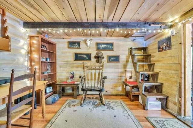 a view of a balcony with wooden floor and furniture