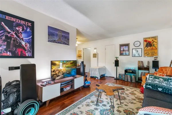 a living room with furniture and a flat screen tv