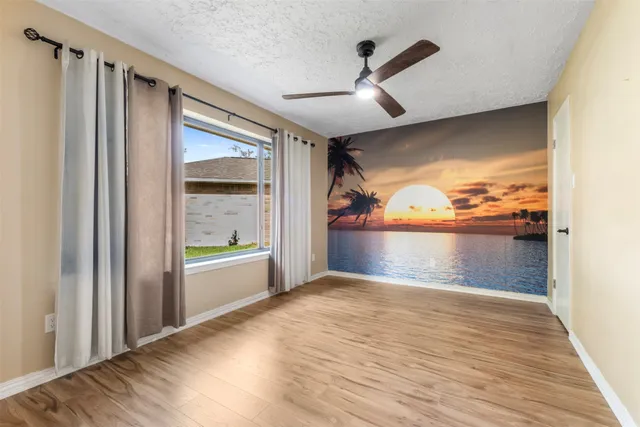 a view of hallway with wooden floor