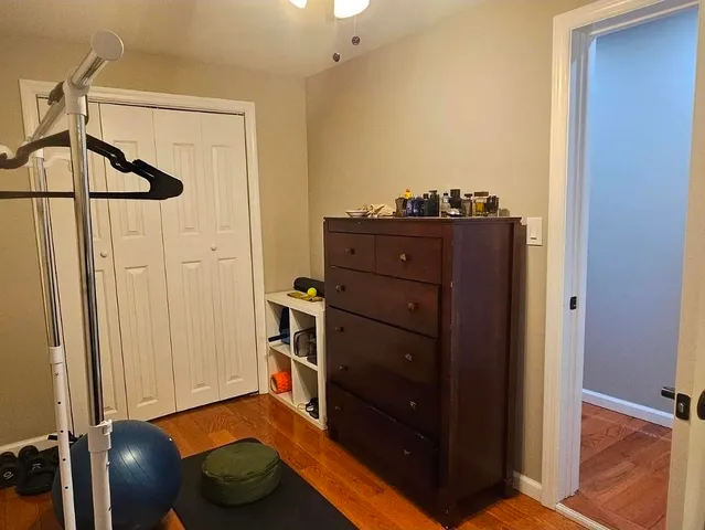 a room with a dresser and a mirror