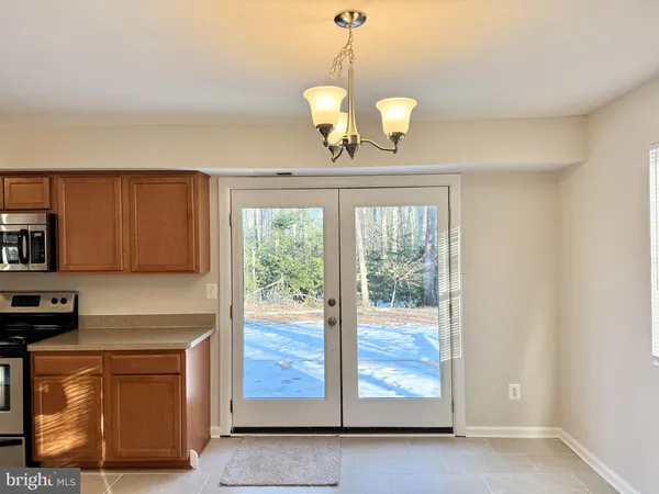 a kitchen with stainless steel appliances granite countertop a stove and a refrigerator