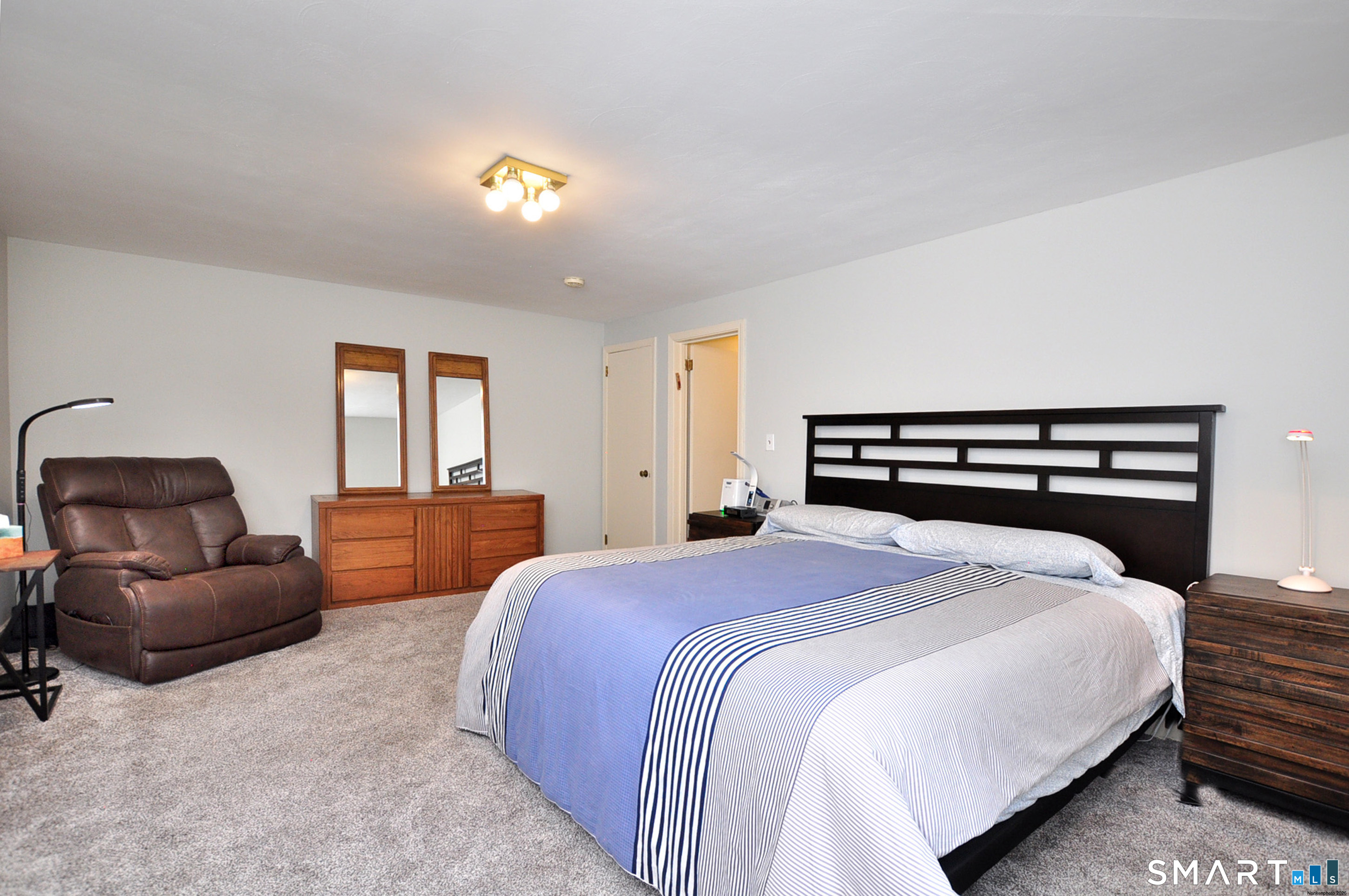 44 Miamis Road West Hartford, CT 06117 - Photo 22 of 39 a bedroom with a bed and a couch