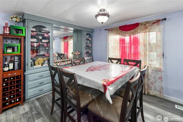 a view of a dining room with furniture and window