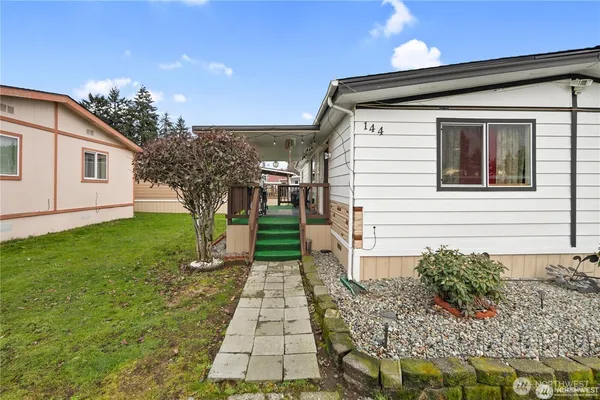 a front view of a house with garden